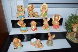 Nine Pendelfin Rabbit Figures and a Dog