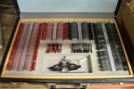 Opticians Suitcase Containing a Quantity of Concave and Convex Spheres and Cylinders