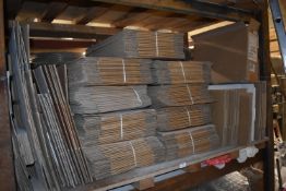 *Shelf of Cardboard Boxes