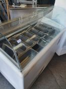 * Interlevin - Carisma serve over ice cream counter