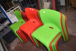 *Four Stackable Plastic Chairs