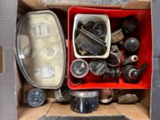 A box of gauges and switches including a Lucas dash lamp, bakelite light switches, an Essex dash