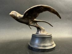 A car accessory mascot in the form of a swallow in flight, display base mounted, approx. 4 1/2