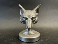 A car accessory mascot in the form of fox's head, display base mounted, approx. 3 1/2
