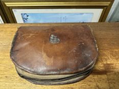 A tan leather vanity set bearing Gordon Bennett rally insignia.
