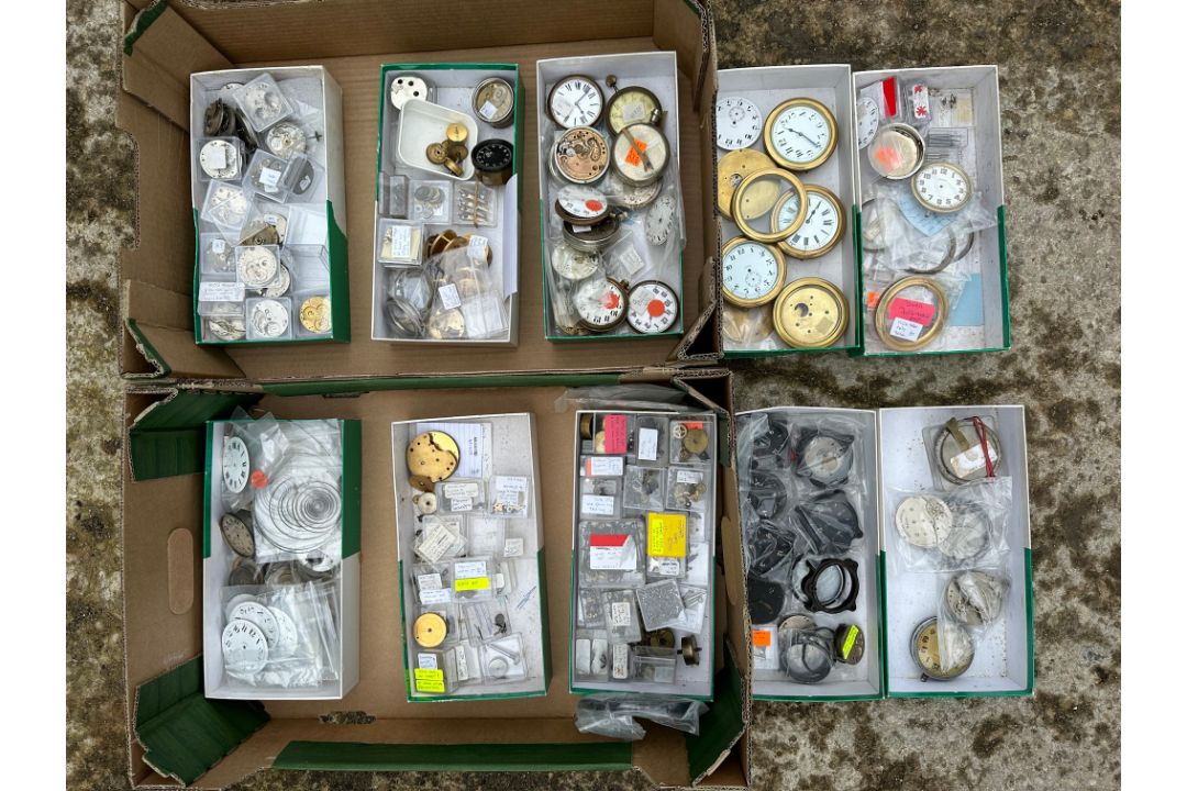 Two trays of car clock parts from a clock restorer.