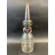 An American glass quart oil bottle with grade band on the neck and tin spout. - Image 1 of 2