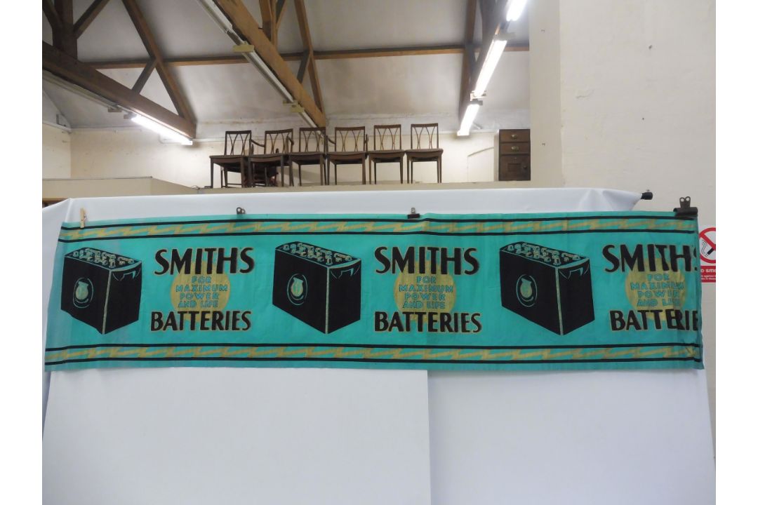 A rare surviving Smiths Battery crepe paper advertisement.