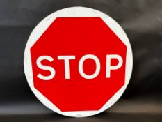 A circular Stop/Go road sign of contemporary manufacture, 24