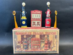 A rare boxed circa 1930s Marx Toys tinplate garage forecourt comprising two petrol pumps flanking