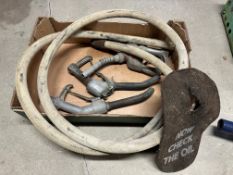 A canvas petrol pump hose, three nozzles etc.