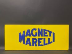 A Magneti Marelli enamel sign in good condition, 36 x 14 1/2