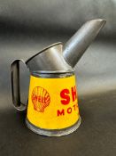A Shell Motor Oil pint measure in superb condition, dated 1948.
