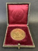 A cased Michelin bronze plaque.