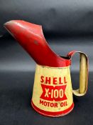 A Shell X-100 Motor Oil pint measure, dated 1956.