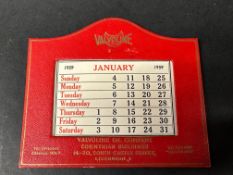 A leather desktop calendar bearing advertising for Valvoline.