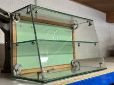 A counter top glass display cabinet with rear opening door, 22