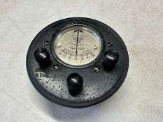 A Smiths combined amp meter and light switch panel.