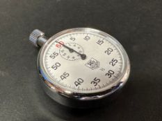 A Tag Heuer 1/5 stopwatch, by repute working.