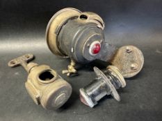 Three early motorcycle lamps.