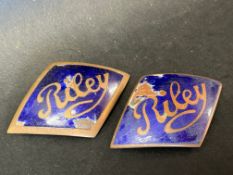 Two early Riley 9 enamel radiator badges.