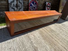 A long tabletop display case, 63
