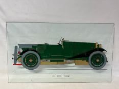 A reverse painted glass display panel depicting a 1926 Bentley 3 litre motor car, 36 x 20 1/2