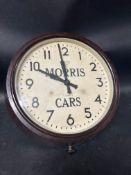 A Smiths eightday dealer's garage wall clock advertising Morris Cars, in bakelite frame, crack to
