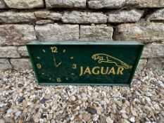 A Jaguar showroom wall clock, slight damage to one corner, 20 x 2 3/4