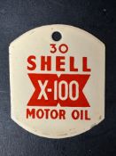 A Shell X-100 Motor Oil 30 grade enamel pump tag, approx. 2 x 2 1/2