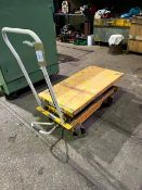 Portable hydraulic work table on wheels