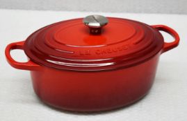 1 x LE CREUSET 'Signature' Enamelled Cast Iron 25cm Oval Casserole Dish In Cerise - RRP £235.00