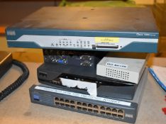 1 x Assorted Collection of Network Equipment Including Cisco 1800 Series, Ciscvo 857, Belkin