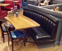 1 x Seating Bench Featuring a Black Faux Leather Upholstery, Ribbed Back and a Curved Solid Oak