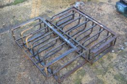 Four cast iron hay feeders, width approx 65cm