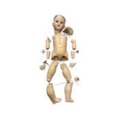 A Hermann Steiner bisque head doll for restringing. Brown eyes, lacking hair. Marked to back of head