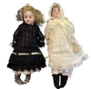 SFBJ bisque head doll in black woollen dress and cream hat. Marked to back of head 60 Paris.