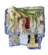 A large quantity of individually bagged doll outfits/garments.