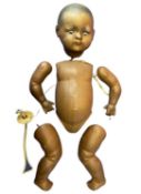 A German bisque head doll for restringing and repair. Black eyes and painted hair. Marked Germany