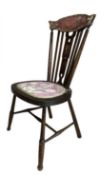 A childs' or dolls' stick back wooden chair with red floral seat. Height approximately 78cm.
