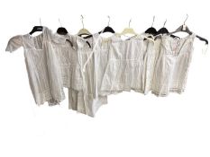 A large quantity of dolls dresses, jackets, christening gowns etc (Please note: whole lot shown over