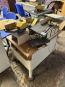 Multi work station to include router, plane, and bench saw.