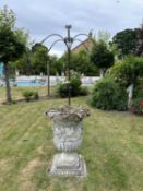 A large decorative composite garden urn, height approx 100cm, width approx 75cm