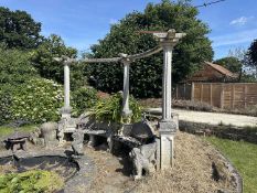 Large composite bench in the shape of a semi-circle with three column supports, overall width approx