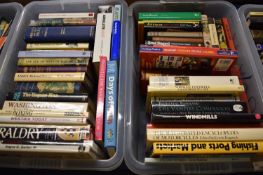 Two boxes of various hardback and softback books including windmills, motorcycle interest,