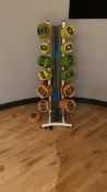 Stand with Reebok barbells and weight plates