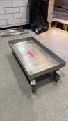 Dolly board on lockable wheels