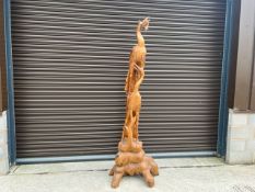 Wooden Carving Depicting Birds Feeding