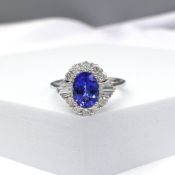 Stylish 1.37 carat tanzanite and 0.57 carat diamond cluster ring in 18ct white gold