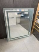 Designer Wall Mounted LED Mirror with Frosted Surround and Touch Button.